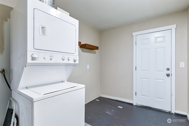 laundry area with stacked washer and dryer