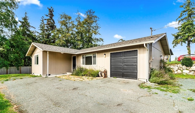 single story home featuring a garage