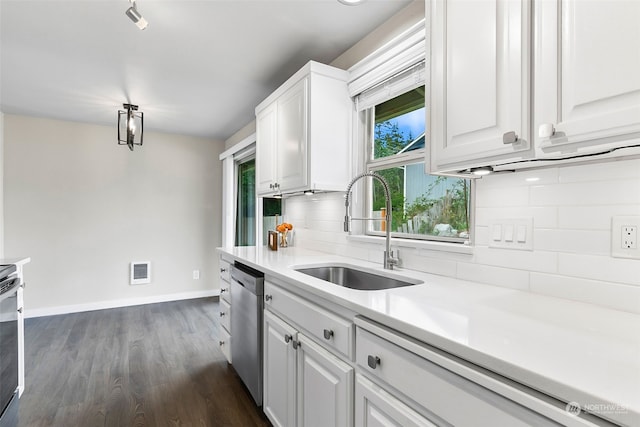 kitchen featuring decorative backsplash, white cabinets, stainless steel appliances, dark hardwood / wood-style floors, and sink