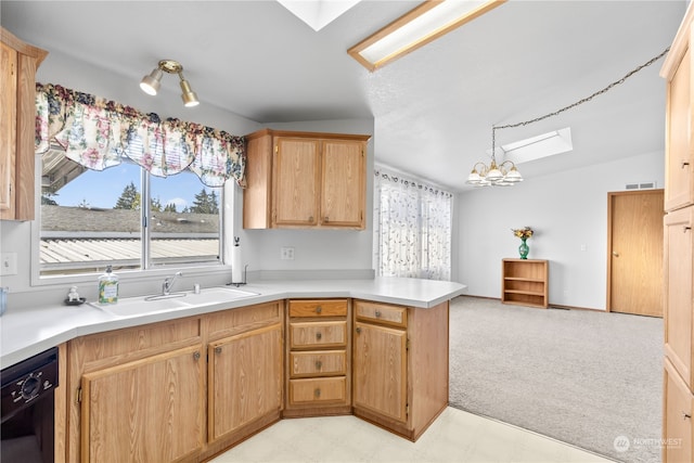 kitchen featuring pendant lighting, vaulted ceiling with skylight, black dishwasher, a chandelier, and kitchen peninsula