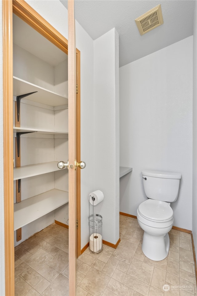 bathroom featuring toilet