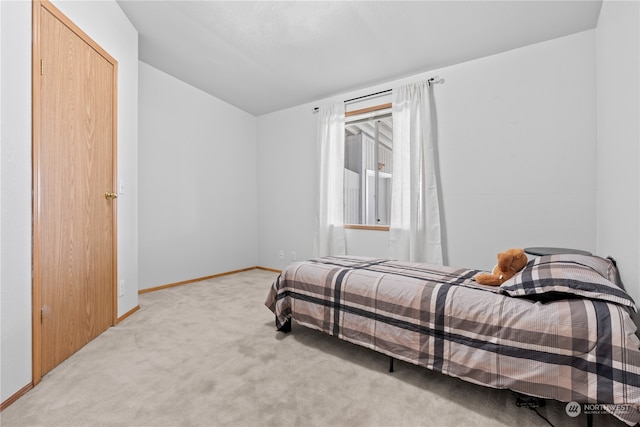 bedroom with light colored carpet