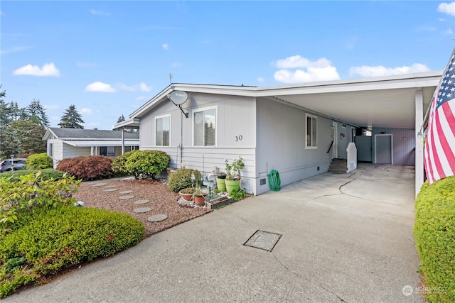 view of front of property with a carport