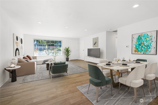 dining area featuring light wood-type flooring