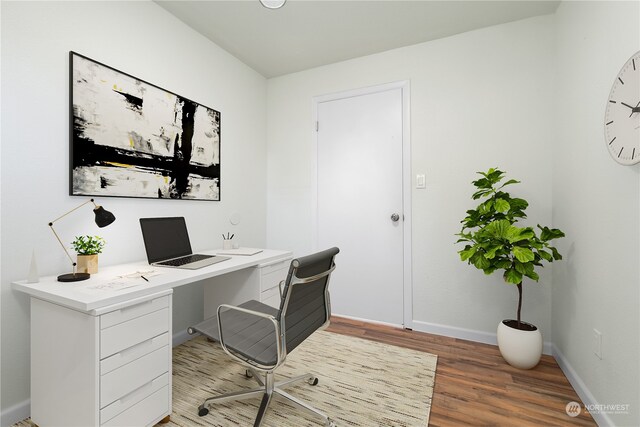 office space featuring hardwood / wood-style floors