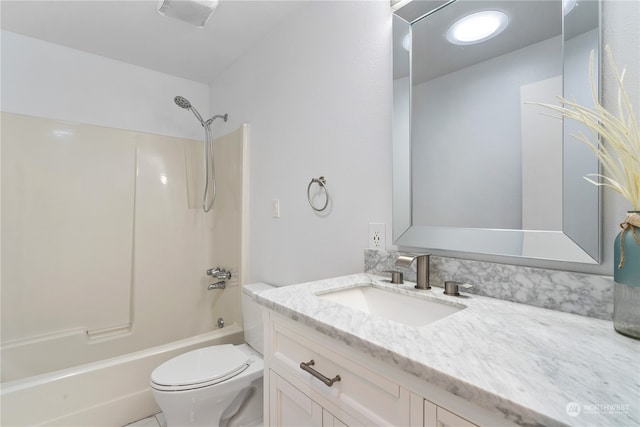 full bathroom featuring shower / bathing tub combination, vanity, and toilet