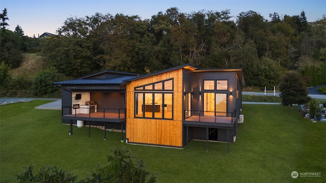 outdoor structure at dusk with a yard