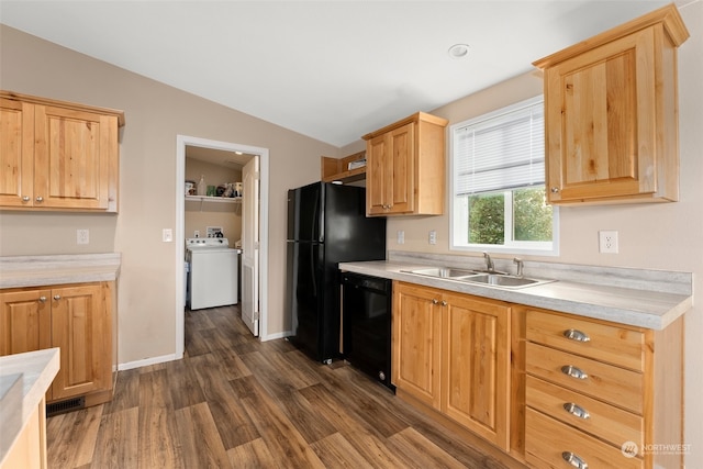 kitchen with vaulted ceiling, dishwasher, dark hardwood / wood-style flooring, washer / dryer, and sink