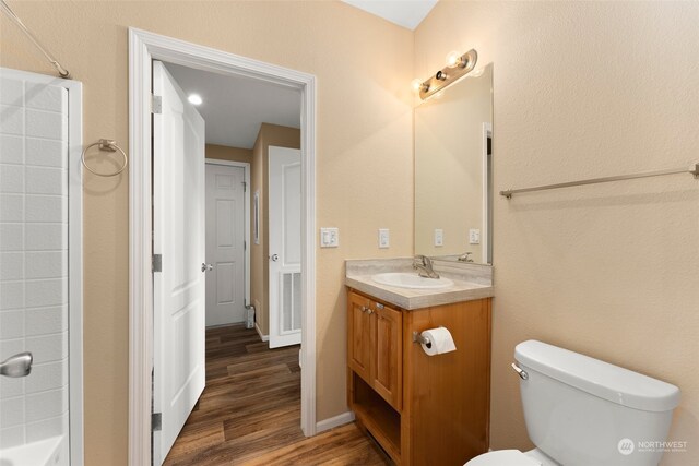 full bathroom featuring shower with separate bathtub, vanity, toilet, and hardwood / wood-style flooring