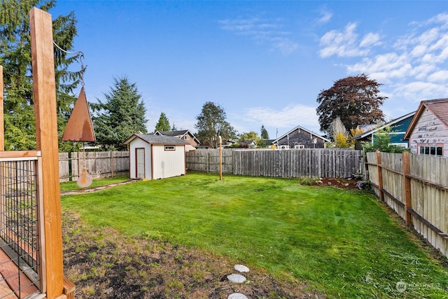 view of yard with a storage unit