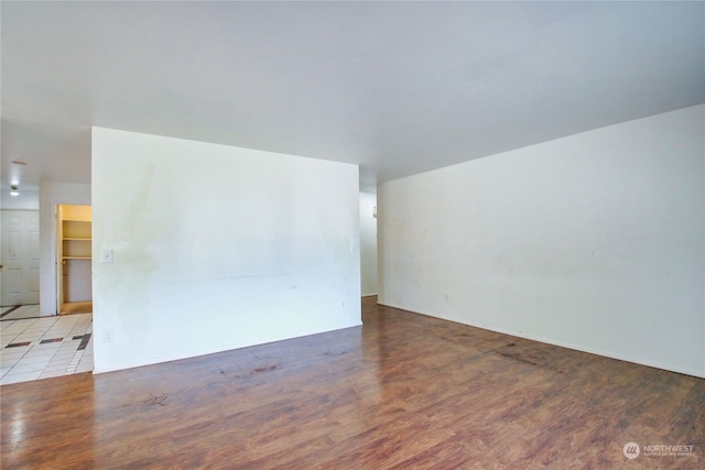 empty room with light hardwood / wood-style flooring