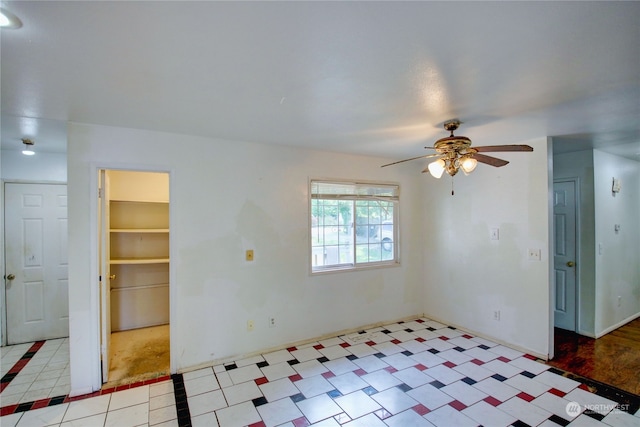 unfurnished room with ceiling fan