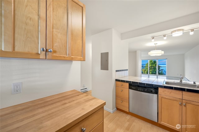 kitchen featuring dishwasher, sink, light wood-type flooring, a baseboard radiator, and tile counters