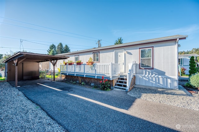 manufactured / mobile home featuring a carport