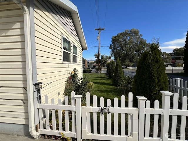 view of side of property with a gate and fence private yard