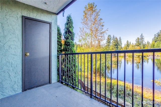 balcony featuring a water view