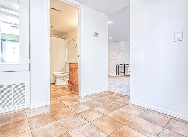 hallway with light tile patterned floors