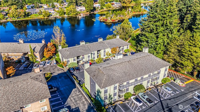 birds eye view of property with a water view