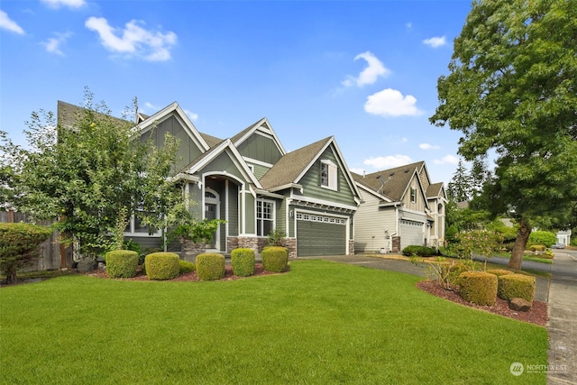 craftsman inspired home featuring a garage and a front yard