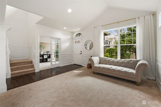 unfurnished room with lofted ceiling and dark hardwood / wood-style flooring