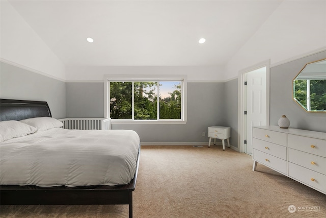 carpeted bedroom featuring vaulted ceiling