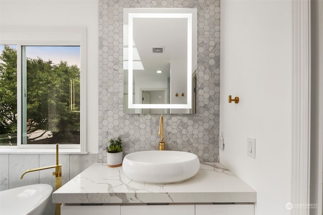 1925 32nd Avenue Ct SW, Puyallup, WA 98373 - bathroom with visible vents, decorative backsplash, and vanity