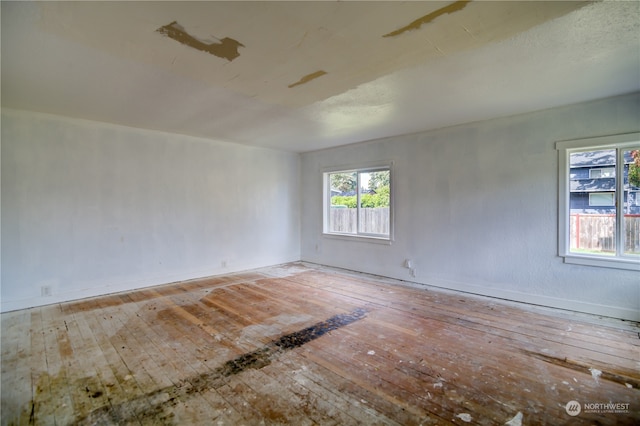 unfurnished room with light wood-type flooring