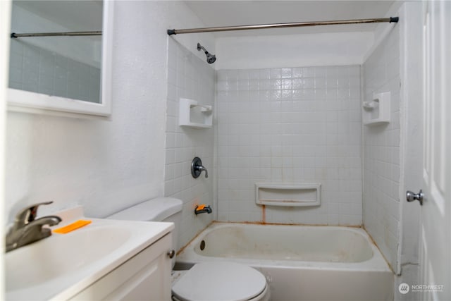 full bathroom with vanity, toilet, and tiled shower / bath