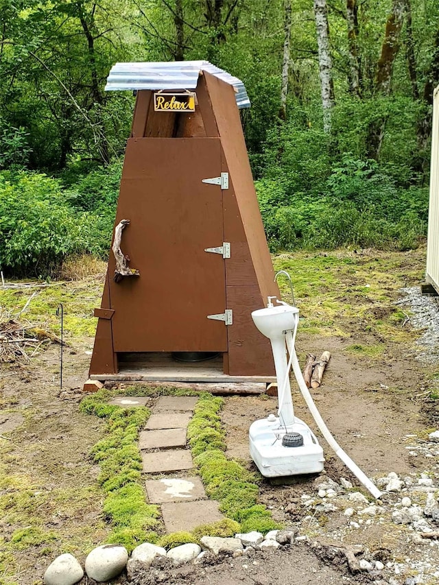 view of entry to storm shelter