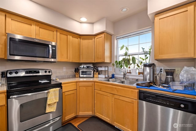 kitchen featuring appliances with stainless steel finishes and sink