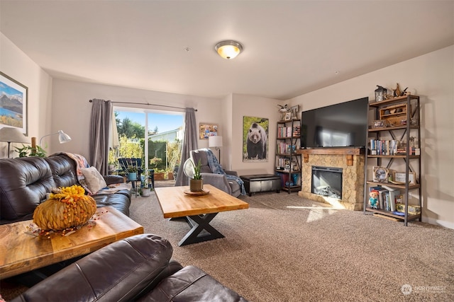 living room with a fireplace and carpet