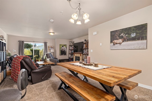 dining area featuring light colored carpet and a notable chandelier