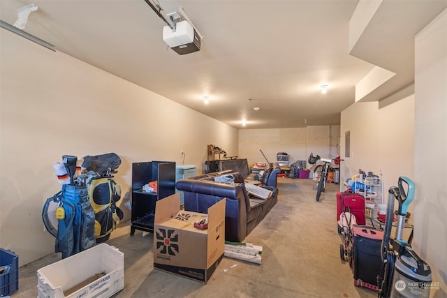 garage with a garage door opener and electric panel