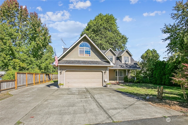 view of front of home featuring a garage and a front lawn