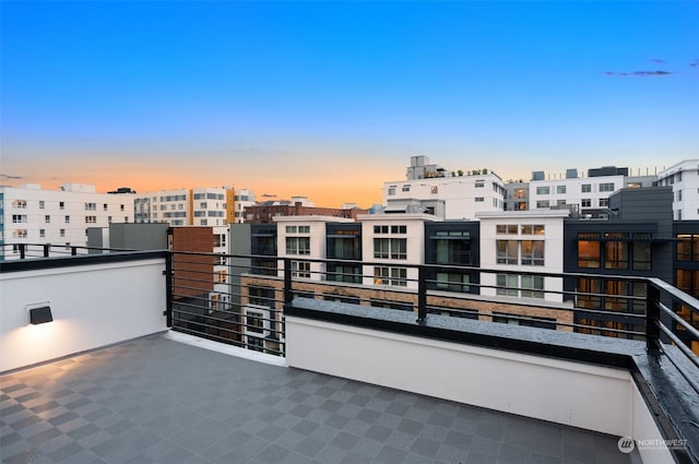 patio terrace at dusk with a balcony