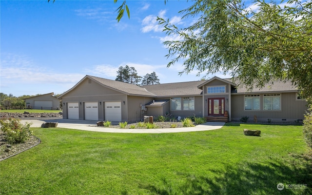 ranch-style home with a garage and a front lawn