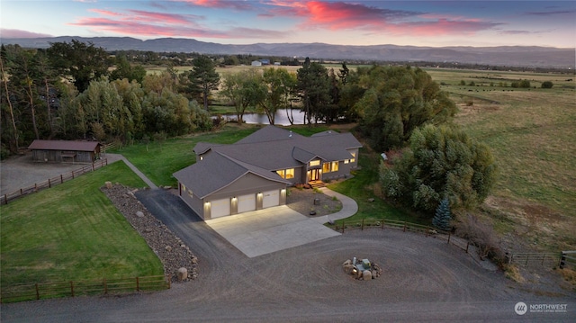 aerial view at dusk with a water and mountain view