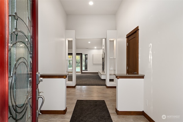 entryway with hardwood / wood-style flooring