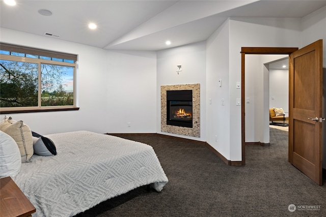 carpeted bedroom featuring vaulted ceiling