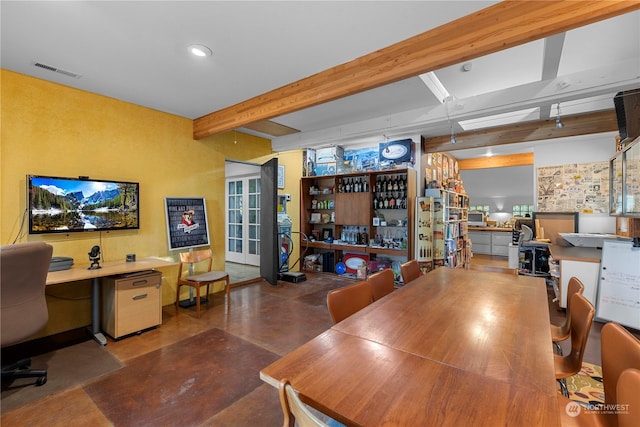 dining room featuring beam ceiling