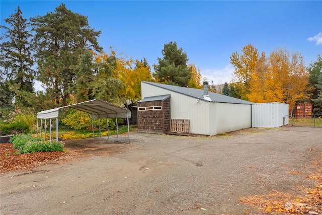 view of side of property with a carport