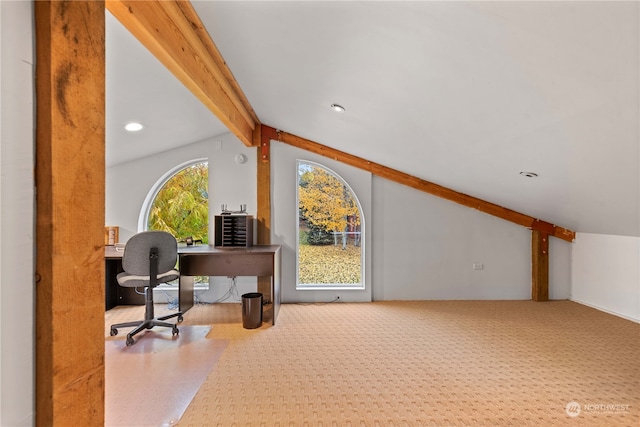 office space featuring lofted ceiling with beams and carpet floors