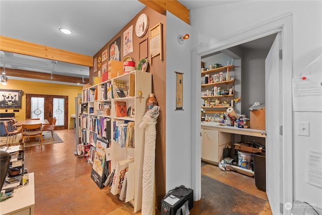 interior space featuring french doors and concrete floors