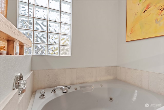 bathroom with tiled bath