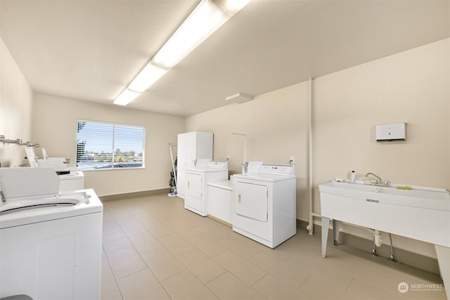 laundry room featuring washing machine and clothes dryer