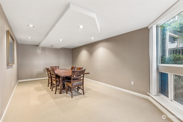 dining room with light carpet