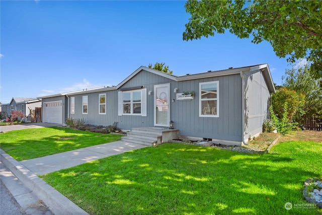 view of front facade with a front yard and a garage