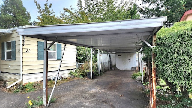 view of parking / parking lot with a carport