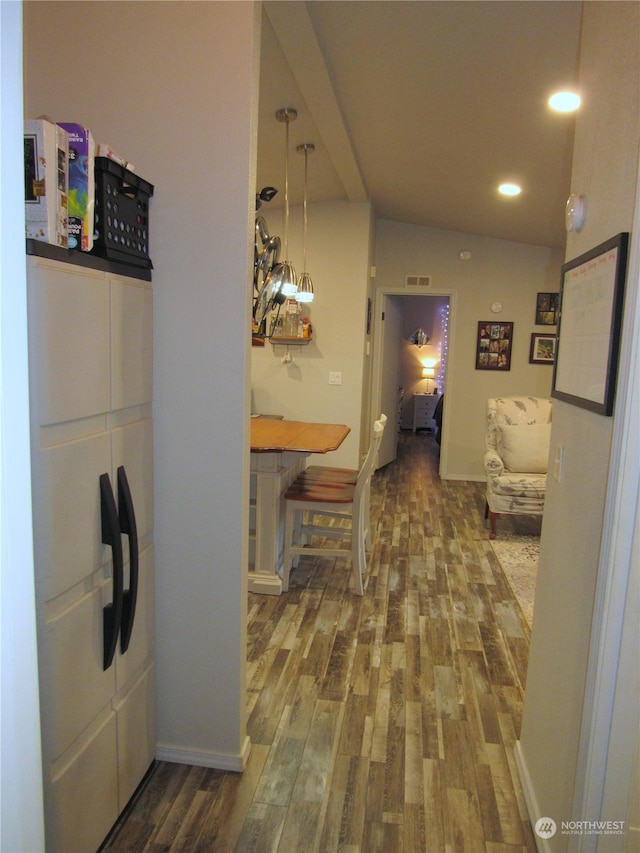 bathroom with wood-type flooring and lofted ceiling