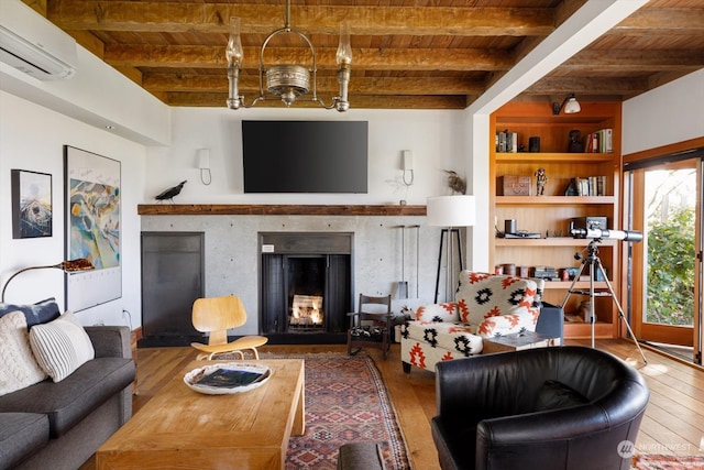 living room featuring a wall mounted air conditioner, a lit fireplace, wood ceiling, and hardwood / wood-style floors